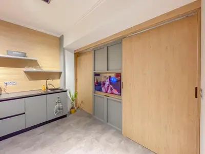 a kitchen with a sliding door with a fish tank at Stylish City Center Apartment by NDK in Sofia