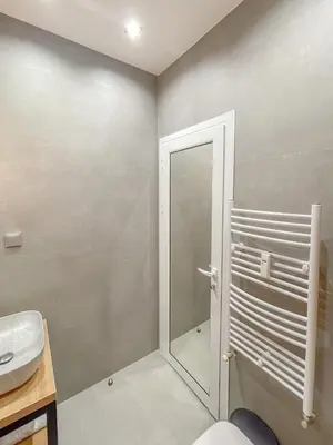 a bathroom with a shower and a sink at Stylish City Center Apartment by NDK in Sofia