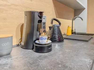 a coffee maker on a counter in a kitchen at Stylish City Center Apartment by NDK in Sofia