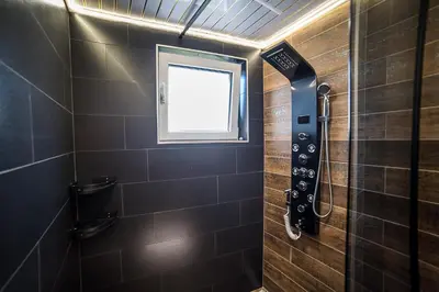 a bathroom with a shower with a window at Apartment Tiana Lux 2 in Hisarya