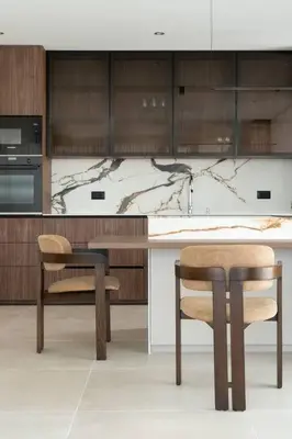 a kitchen with two chairs and a table and cabinets at Cozy Elegant 2BR Apt + Free Parking next to Paradise Mall in Sofia