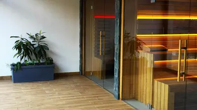 an entrance to a building with a plant in a pot at Waterside SPA Hotel in Ognyanovo
