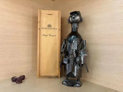 a statue of a dog standing next to a bottle of wine at Vitosha Sunrise in Sofia