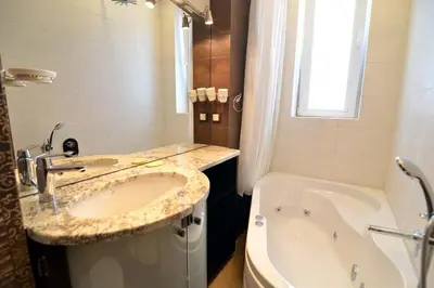 a bathroom with a sink and a tub next to a bath tub at Vitosha Sunrise in Sofia