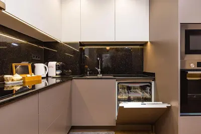 a kitchen with white cabinets and a sink at Central Victoria Home 2-bedroom apt in Plovdiv