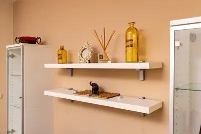 a shelf with a cat figurine on a board at Beautiful apartment in the heart of Plovdiv in Plovdiv