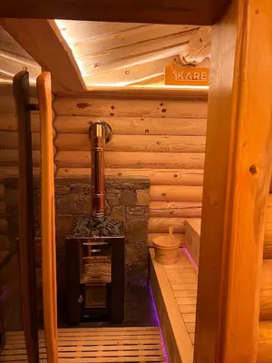 an inside view of a stove in a wooden cabin at Kare Luxury Chalets in Tsigov Chark