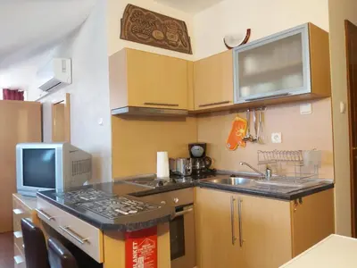 a small kitchen with a sink and a microwave at Апартамент-студио Б4-4-1 Божурленд in Bansko