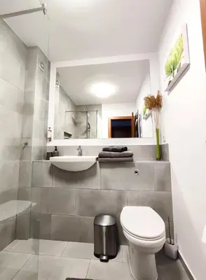 a bathroom with a toilet and a sink at GALA 2Bedroom Apartment 200m from Gondola in Bansko