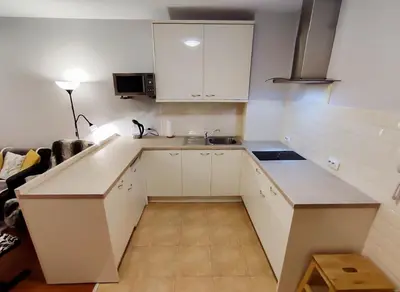 a small kitchen with white cabinets and a sink at GALA 2Bedroom Apartment 200m from Gondola in Bansko
