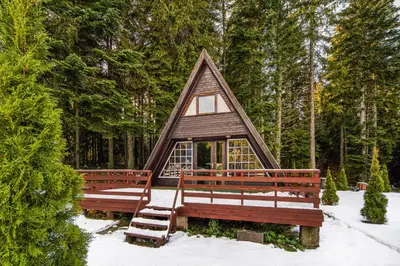 a small cabin with two benches in the snow at Chalet Musala Borovets by BookVillaBG in Borovets
