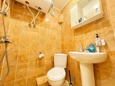 a bathroom with a toilet and a sink at Cozy and quiet central apartment in Sofia
