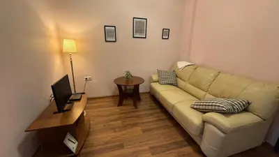 a living room with a couch and a table at Quiet 2 bedrooms downtown apart in Sofia
