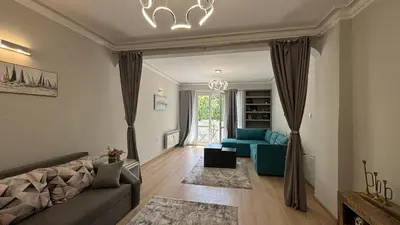 a living room with a couch and a chair at Garden view top center apart in Sofia