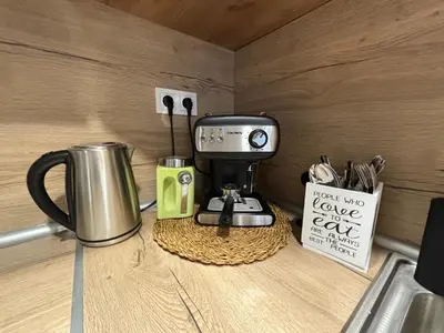 a coffee maker sitting on top of a counter at Garden view top center apart in Sofia