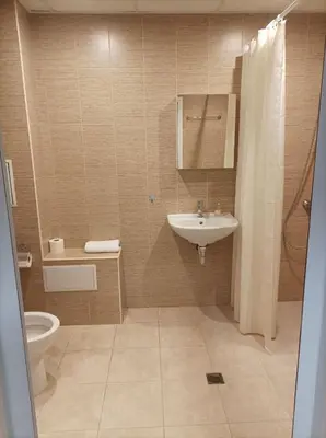 a bathroom with a sink and a toilet at Terra apartment in Sandanski