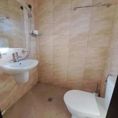 a bathroom with a toilet and a sink at Aura house in Dolna Banya