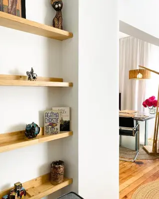 a room with wooden shelves on the wall at Este Apart Historical Center in Sofia