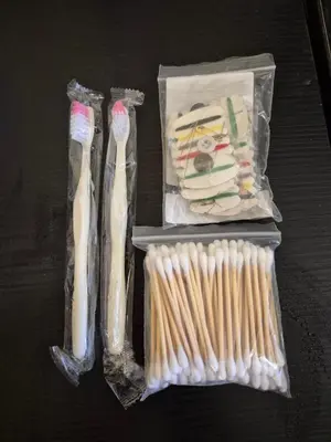 a group of toothbrushes in plastic bags on a table at Private stay place in Sofia