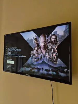 a flat screen tv hanging on a wall at Private stay place in Sofia