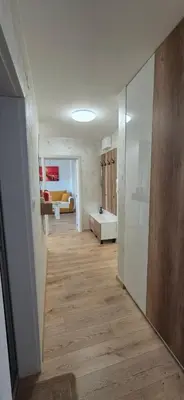 a hallway with a living room and a living room with at Panorama Apartment in Plovdiv