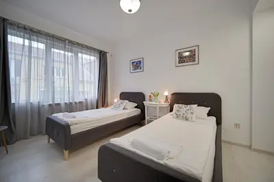 a room with two beds and a window at Tulip Dreamland in Sofia