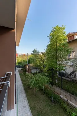 a view of a garden from the balcony of a building at Bissera premium apartments in Sofia