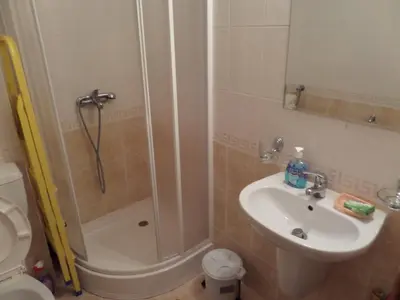 a bathroom with a shower and a sink and a toilet at Apartment in Complex Monastery 1 in Pamporovo