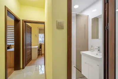 a bathroom with a sink and a mirror at Top Location Central New & Spacious 3 BDR apt Medical Academy in Sofia