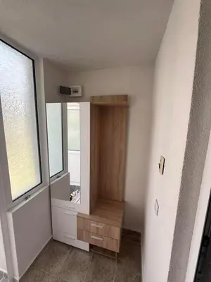 a empty room with a mirror and a window at Къща за гости Горски рай in Smilyan