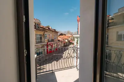 a view of a city street from a window at Лондонъ - къща за гости / London - guest house in Kyustendil