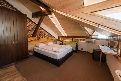 a bedroom with a large bed in a room at Лондонъ - къща за гости / London - guest house in Kyustendil