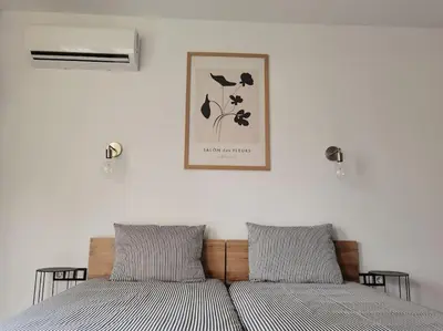 two beds sitting next to each other in a bedroom at The Courtyard 2Bdrm Apartment in Sofia