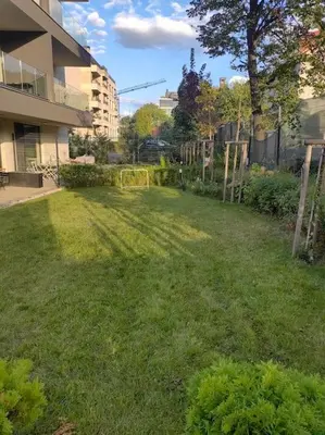 a grassy yard in the middle of a building at The Courtyard 2Bdrm Apartment in Sofia