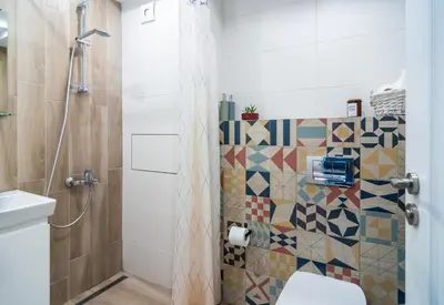 a bathroom with a shower and a toilet at Artistic Flat in City Center for Business&Pleasure Trips in Sofia