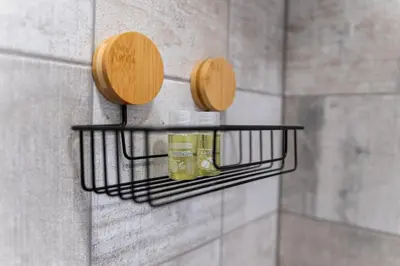 a shelf on a wall with two wooden plates on it at City Center Retro Chic Kapana 2-Bed Apartment in Plovdiv