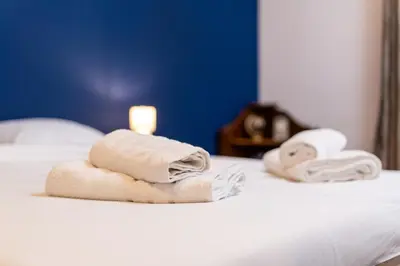 two towels sitting on top of a bed at City Center Retro Chic Kapana 2-Bed Apartment in Plovdiv