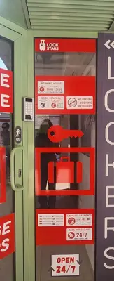 a gas pump with signs on the side of it at Apart Hotel Roma in Sofia