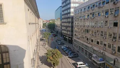an aerial view of a city street with buildings at The Central Post Apartments in Sofia
