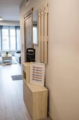 a room with a counter with a sign on it at Modern 1BR Comfort in Oborishte with Private Parking in Sofia