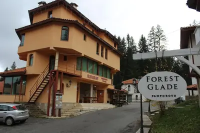 a house with a sign in front of it at Apartment Atanasov - Pamporovo in Pamporovo