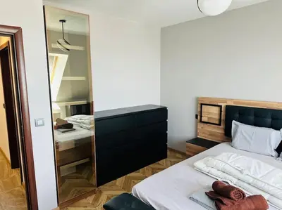 a bedroom with a large mirror and a bed at 15% Discount! Limited Time in Sofia