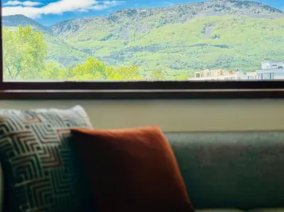 a window with a view of a mountain at 15% Discount! Limited Time in Sofia
