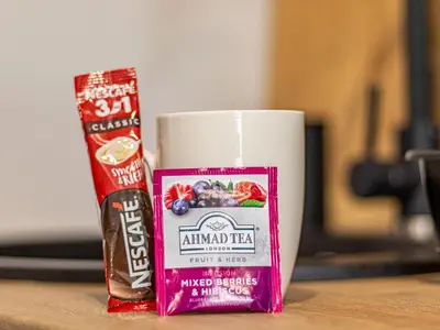 a cup of almondica and a can of mixed drinks at Stay Central: Urban Studio Gem in Sofia