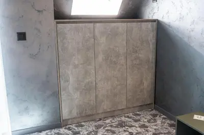 a large wooden cabinet in a room at RCR Einstein studios in Sofia