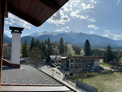 a view of a town with mountains in the background at Apartament Armada Bansko in Bansko
