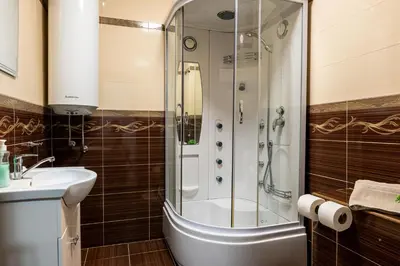 a bathroom with a shower and a sink at Апартамент за гости ВениАн in Velingrad