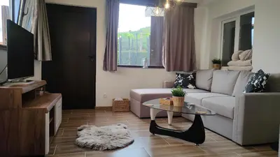 a living room with a couch and a table at Guest House Saint George in Vukovo