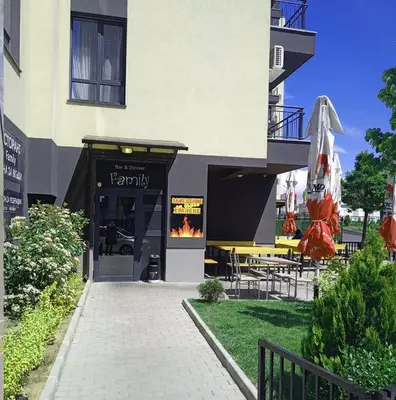 a building with a restaurant with a fire in it at Alis Savana in Sofia