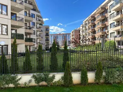 a fence in front of a apartment building at Idea Apartment in Sofia